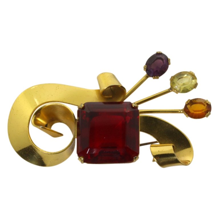 Vintage Coro Gold Tone Sterling Brooch: Est. $ 75 - 150 Vintage Coro Gold Tone Sterling Brooch. Sterling 30.9 grams tw. Gold tone brooch with multicolor round and square cut stones. Marked Coro and Sterling. 2 7/8 inches long.