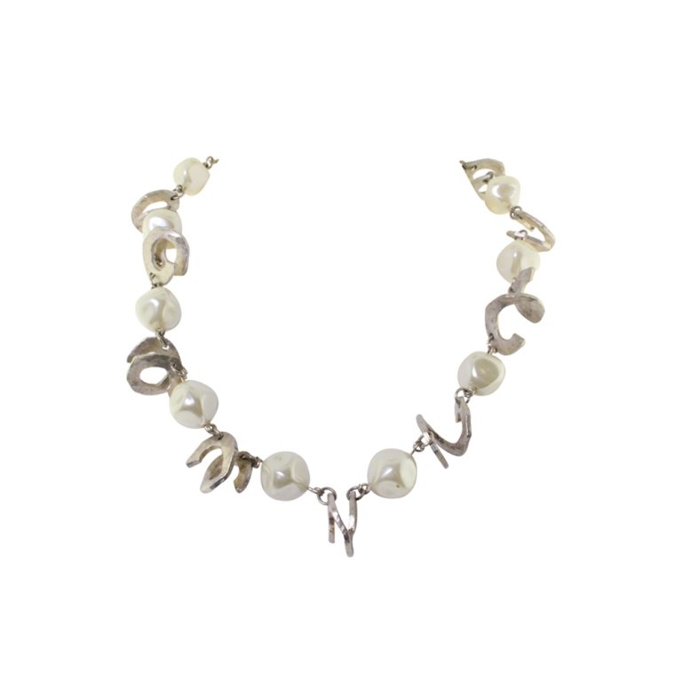 Cecile Jeanne Faux Pearl Necklace: Est. $ 30 - 70 Cecile Jeanne Faux Pearl Necklace. Faux pearl necklace with stylized silver spiral links. Marked Cecile Jeanne. Paris. 18 inches long.