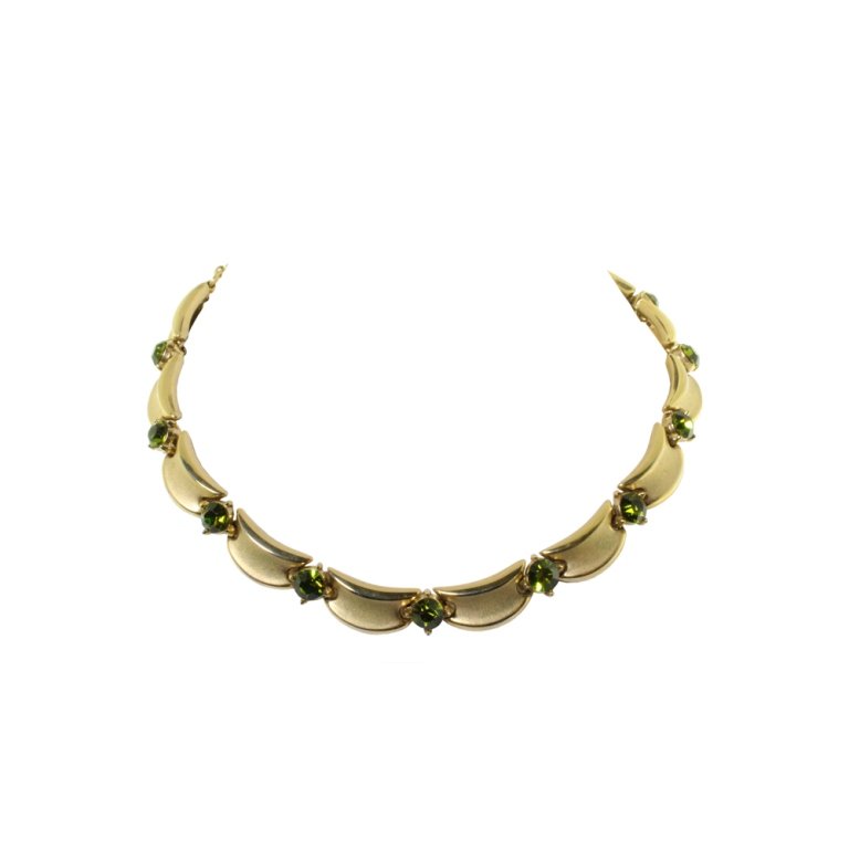Trifari Chrome Green Rhinestone Necklace: Est. $ 20 - 40 Trifari Chrome Green Rhinestone Necklace. Gold tone necklace with chrome green rhinestones. Marked Trifari. 16 inches long.