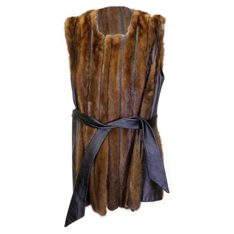Paul Diener Couture Furs Leather & Fur Vest: Est. $ 50 - 100 Paul Diener Couture Furs Leather & Fur Vest. Belted leather and fur vest. Some tears in fur and at seams. Bust 40 and length 30 inches.