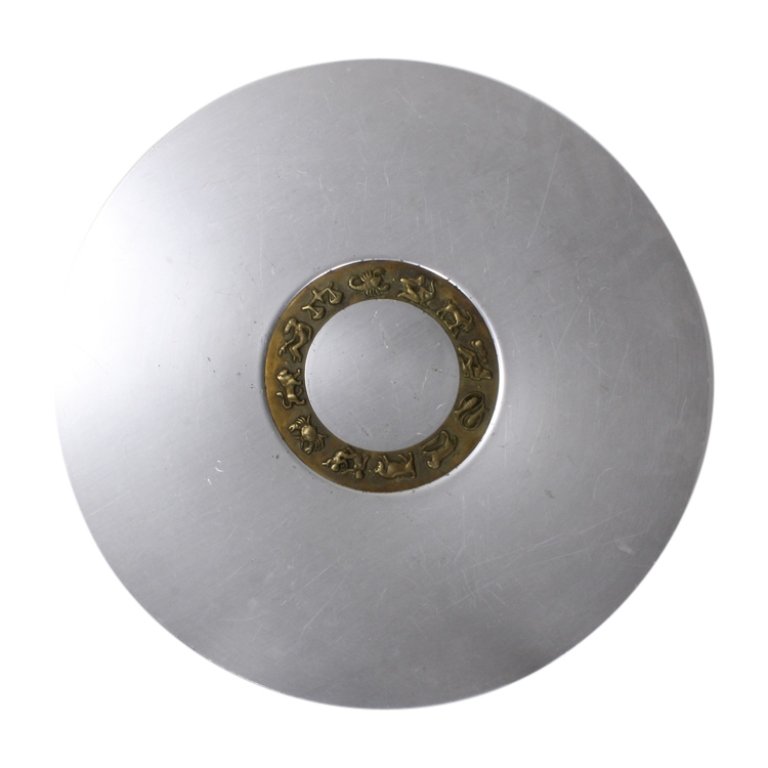 Large Platter with Zodiac Symbols: Est. $ 30 - 50 Large Platter with Zodiac Symbols. Platter is 18 inch diameter. Center circle is brass with Zodiac Symbols. Chips and scratches on platter