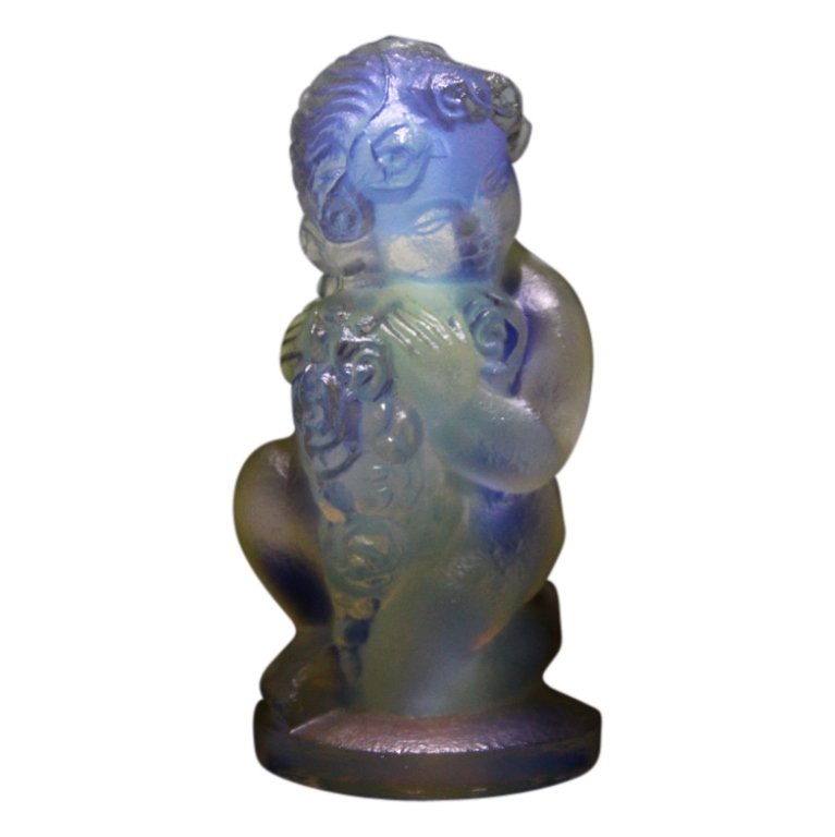 Sabino France Opalescent Angel: Est. $ 100 - 150 Sabino France Opalescent Angel. Opalescent glass angel is 2 inches tall. Signed.