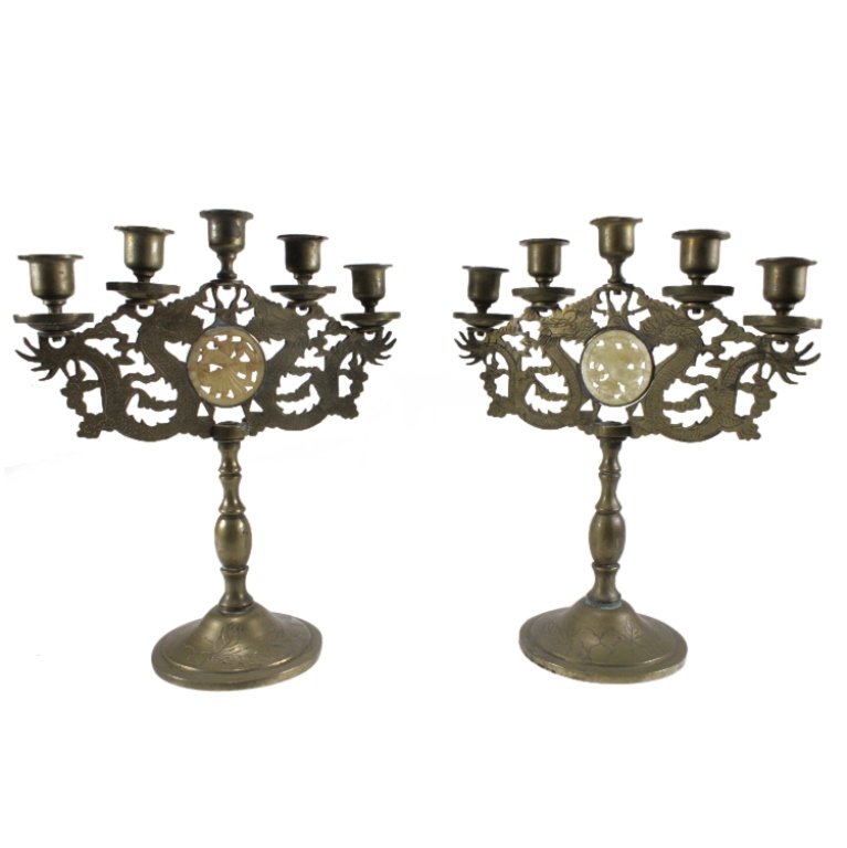 Pair Copper Tone Menorahs with Dragon Medallion: Est. $ 40 - 60 Pair Copper Tone Menorahs with Dragon Medallion. Measures 11.25in Tall, 9.25in Wide.