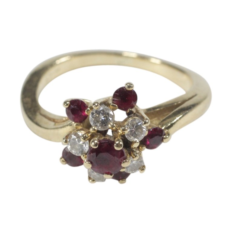 14k Yellow Gold Garnet and Diamond Ring: Est. $ 160 - 200 14k Yellow Gold Garnet and Diamond Ring. Weighs 3.3 grams. (5) .04 ct ea diamonds, Near colorles, SI clarity. (6) multifaceted garnets.
