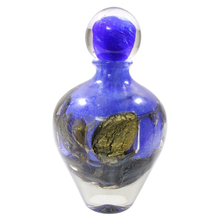JC Navarro Blue Hand Blown Vase: Est. $ 500 - 1000 JC Navarro Blue Hand Blown Vase. Marked JC Navarro and signed. Measures 9.25 inches tall with stopper. Landscape design.