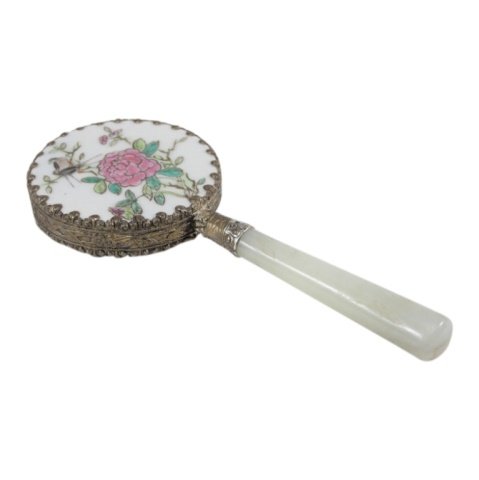 Jade and Hand Painted Enamel Mirror: Est. $ 20 - 60 Jade and Hand Painted Enamel Mirror. Measures 4.75 inches long and 2 inches in diameter. Floral bird design.