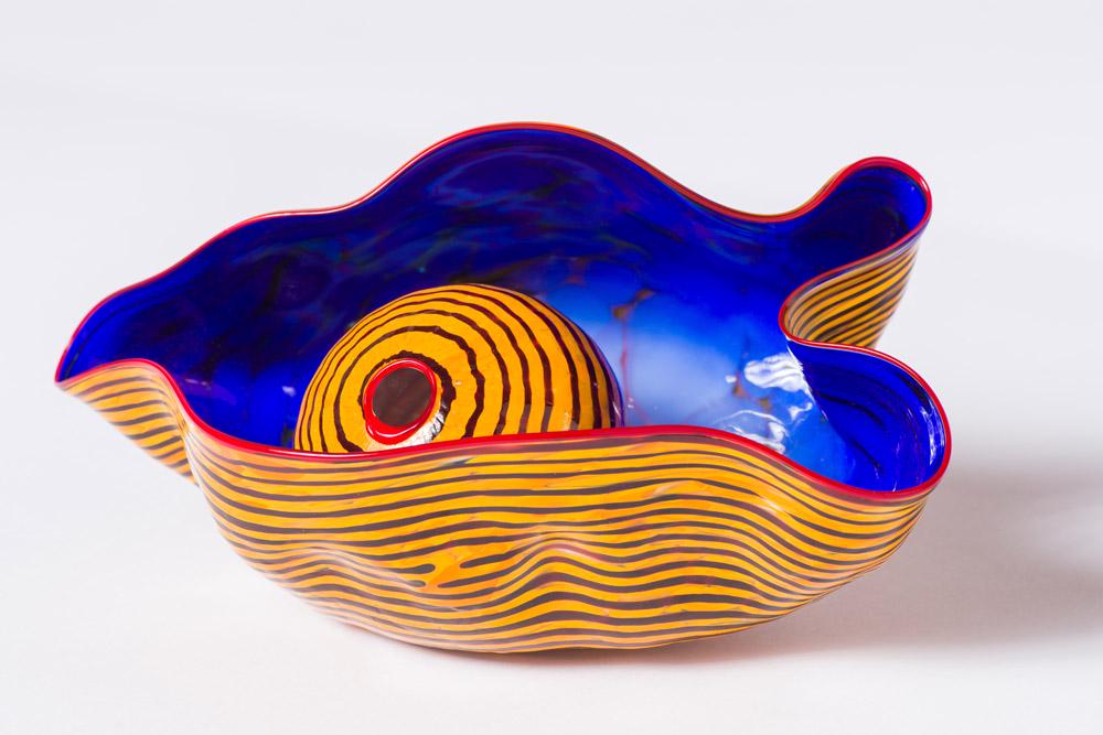 Dale Chihuly (2) Element Basket Set with Red Lip Wraps: Dale Chihuly (American, b. 1941) (2) Element Basket Set with Red Lip Wraps, 1984 Glass 5.75 x 11.5 x 6.75 (in) Engraved Chihuly 1984, bottom of basket Ball element measures 4" in diameter.