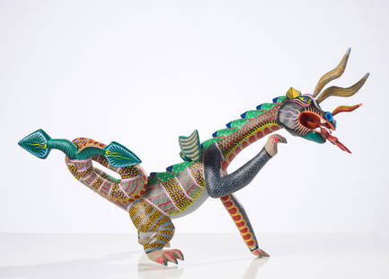 Antonio Mandarín Untitled Dragon Alebrije: Antonio Mandarín (Mexican, 20th Century) Untitled Dragon Alebrije Acrylic on carved wood 23.25 x 42 x 17 (in) Signed in green pen Antonio Mandarin G., bottom Located ARRAZOLA OAXACA in green