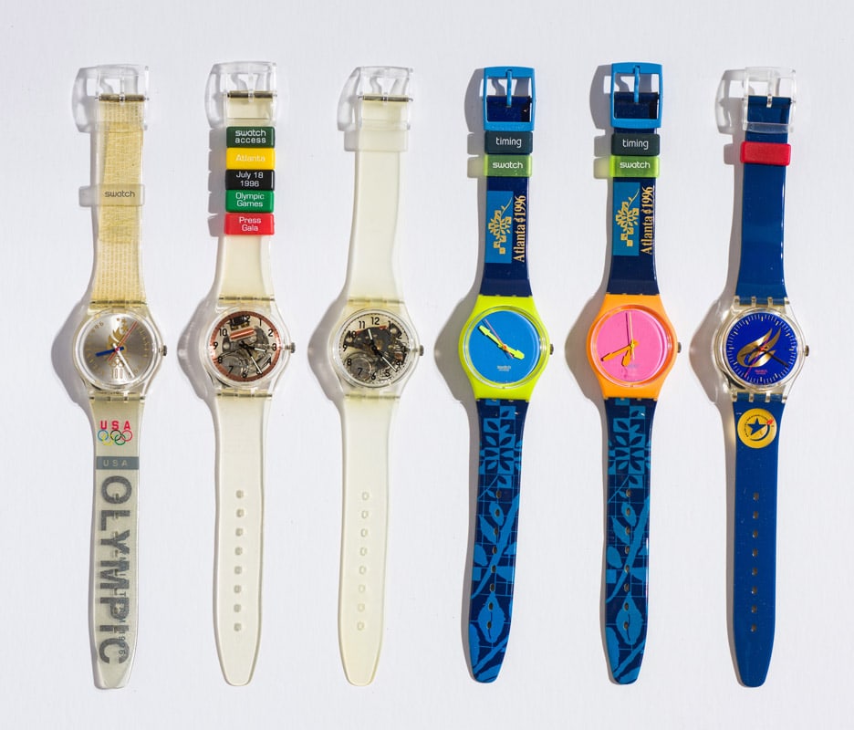(11) Various Olympic Swatches: US Olympic Teams (GZ150J). 1996. Quartz. Plastic Case Material. Plastic Strap. Pin Buckle. Access PRESS GALA Watch (SKK100C). 1996. Quartz. Plastic Case Material. Plastic Strap. Pin Buckle. Special Ol