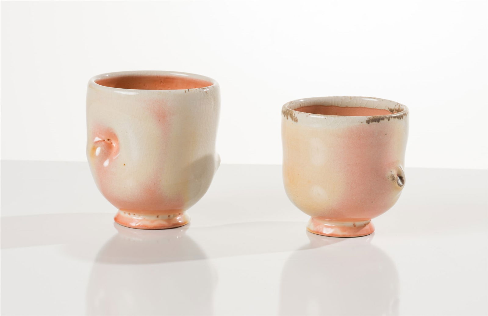 Chris Gustin (2) Cups: Chris Gustin (American, b. 1952) (2) Cups Ceramic 4.5 x 4.5 x 4.25 (in) Artist's stamp, bottom of each work Dimensions reflect the largest cup. Weight reflects the entire lot. Smaller cup measures 4 x