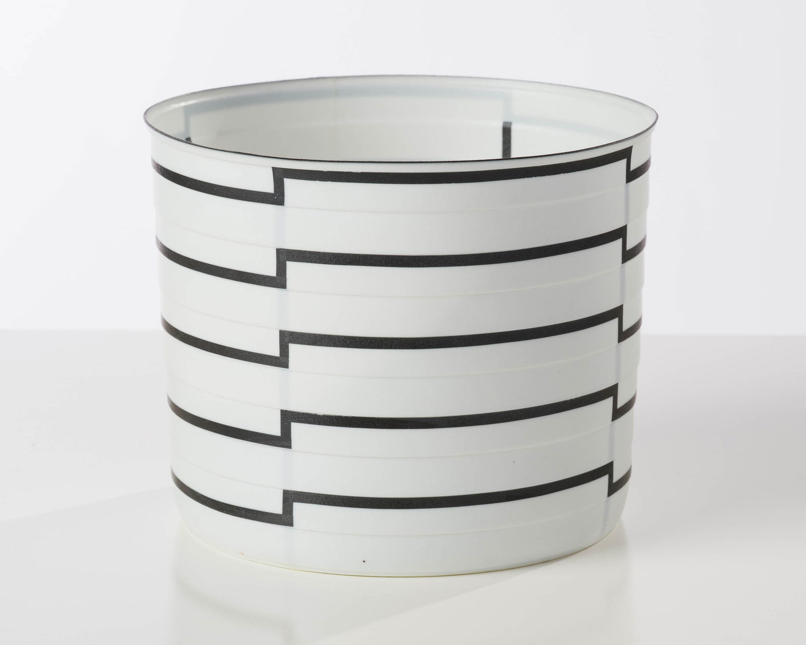 Bodil Manz Black and White Cylinder: Bodil Manz (Danish, b. 1943) Black and White Cylinder Slip-cast porcelain with firing-transfers 7.75 x 9 x 9 (in) Signed Bodil Manz [artist's symbol], bottom Notation '12' on label, bottom.