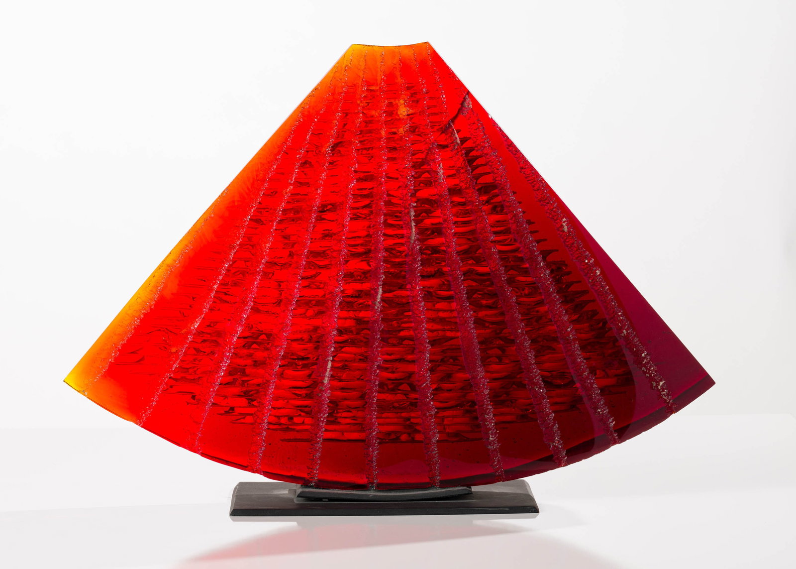 Stephen Dee Edwards Orange Fan, 2003-5: Stephen Dee Edwards (American, b. 1954) Orange Fan, 2003-5 Cast glass on metal base 18 x 25.25 x 6 (in) Incised Stephen Dee Edwards 7/20/03/05, back lower edge $2,000 - $4,000 Dimensions include base.
