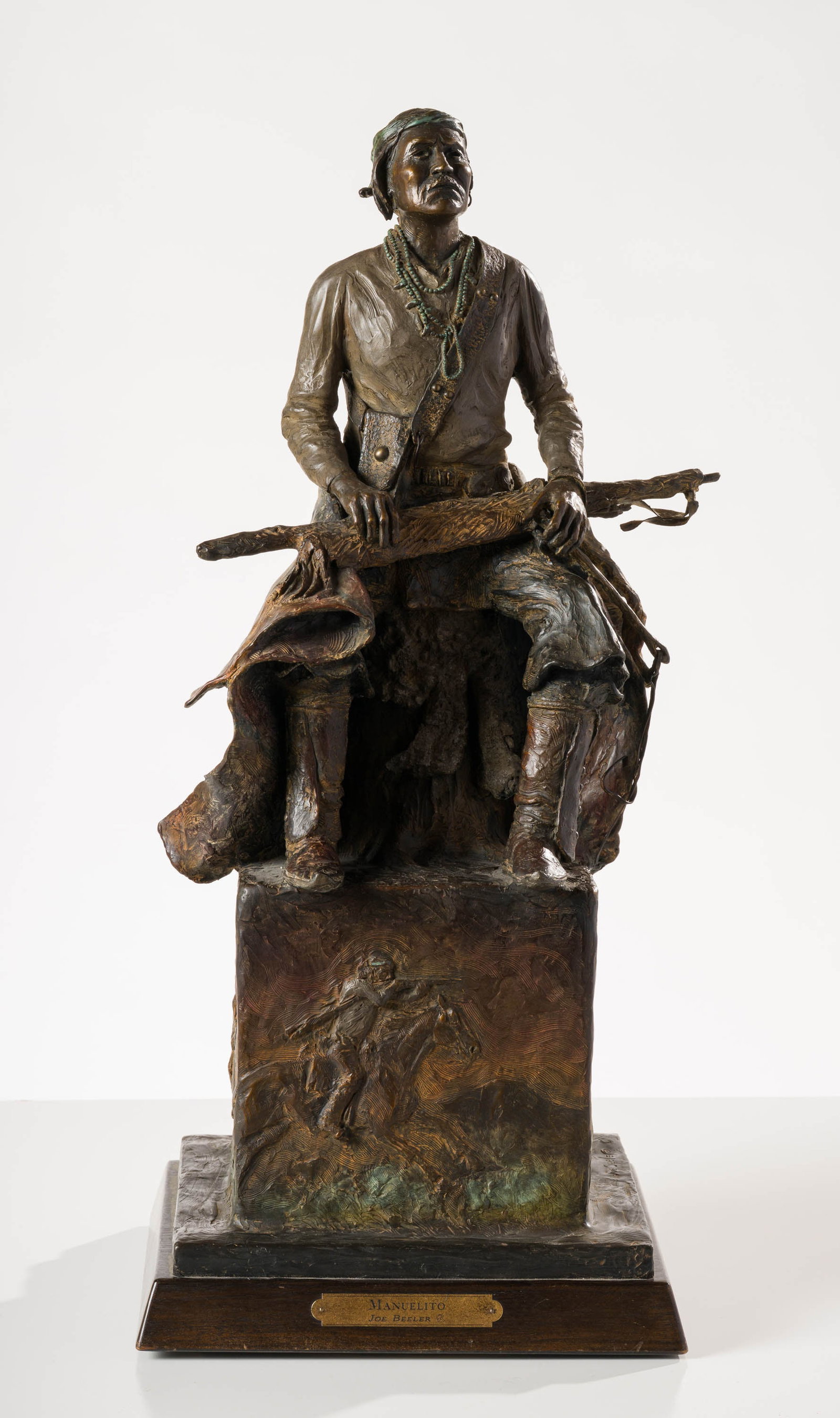 Joe Beeler Manuelito: Joe Beeler (American, 1931-2006) Manuelito Bronze on wooden plinth ed. 2 of 45 29.5 x 14 x 13 (in) Incised Joe Beeler CA, base $3,000 - $5,000 Dimensions include the plinth. Plinth measures 1.75 (in)