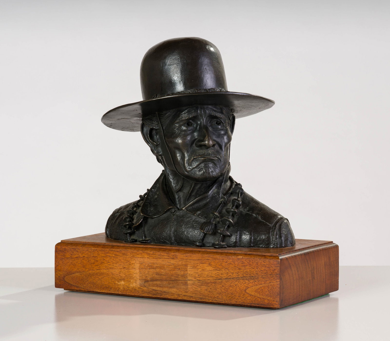 Robert Rishell Grey Whiskers: Robert Rishell (American, 1917-1976) Grey Whiskers Bronze on wooden plinth ed. 7 of 25 14 x 15 x 9.5 (in) Incised Robt L. Rishell, back $500 - $1,000 Incised "? Grey Whiskers", back. Art Bronzes stamp