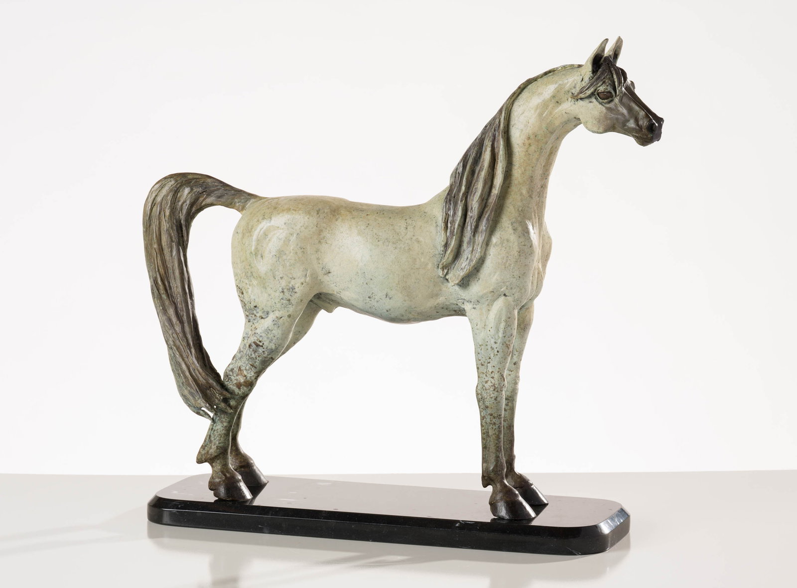 Marie Barbera The Arabian: Marie Barbera (American, b. 1936) The Arabian Bronze on stone plinth Artist's Proof I from an unknown ed. 21.25 x 23.25 x 7 (in) Incised M Barbera, back hoof Dimensions reflect the entire work. 
