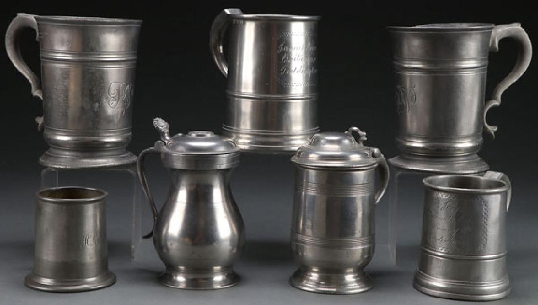 7 GEORGIAN PEWTER TANKARDS AND MEASURES: A COLLECTION OF SEVEN ENGLISH GEORGIAN PEWTER TANKARDS, BEAKERS AND MEASURES. Each with stamped hallmarks. The largest 6.5 inches. SHIPPING NOTICE: Jackson’s is your sole and only source for one sto