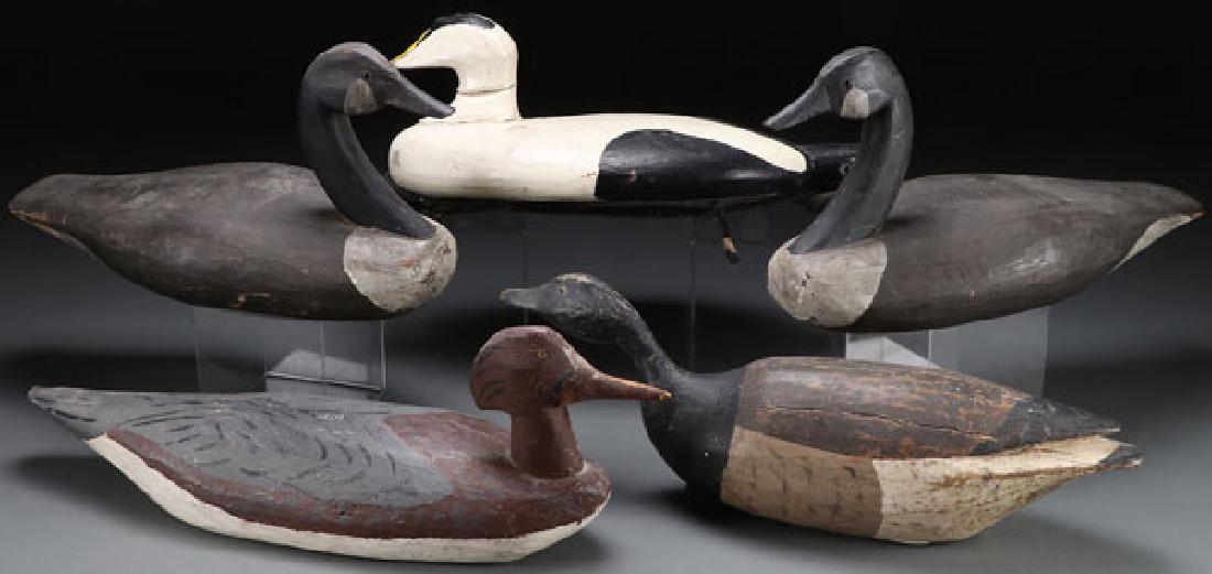 FIVE CARVED AND PAINTED WOOD DECOYS, 20TH CENTURY: FIVE CARVED AND PAINTED WOOD DECOYS, 20TH CENTURY. One with label inscribed to Nathan Cobb, two initialed on underside “R.E.W.”, and one indistinguishably signed. Greatest length 23 inches. SHIPPI