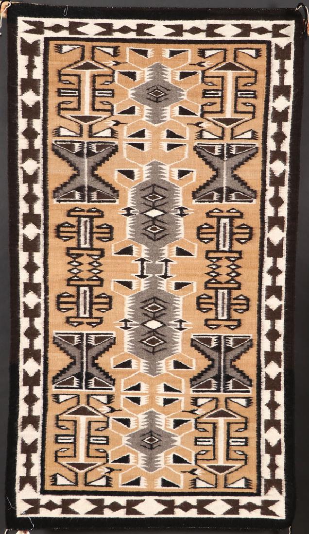 A GROUP OF FIVE SOUTHWEST NAVAJO HANDWOVEN RUG: A GROUP OF FIVE SOUTHWEST NAVAJO HANDWOVEN WOOL RUGS, 3RD QUARTER OF THE 20TH CENTURY. Comprising a “Storm” pattern by Alice Bake Begoj, Pinon, AZ, 57 inches x 32 inches; a “Storm” pattern by 