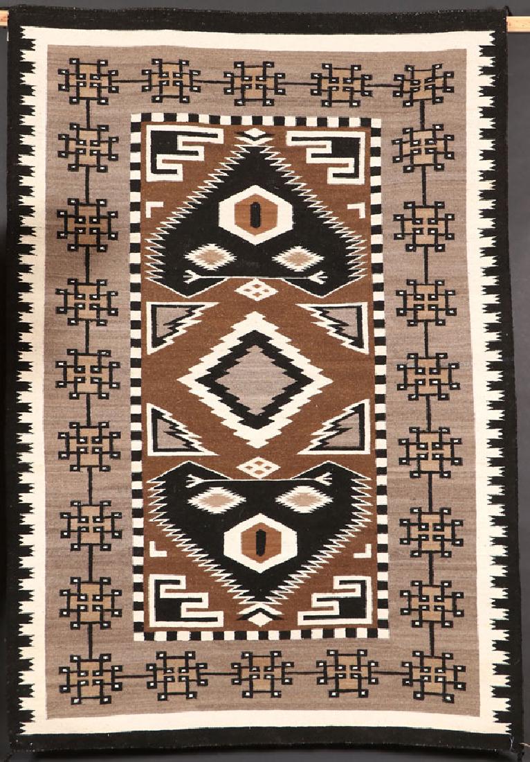 A LARGE SOUTHWEST NAVAJO “TEEC NOS POS” RUG: A LARGE SOUTHWEST NAVAJO “TEEC NOS POS” HANDWOVEN WOOL RUG, CIRCA 1978. With Crownpoint weaver’s rug for Annabelle R. Benally, Burnaham, AZ. 84 inches x 57 inches. SHIPPING NOTICE:Jackson’s i
