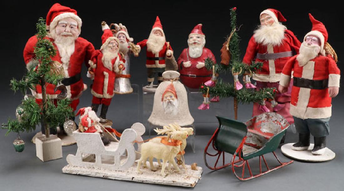 A COLLECTION OF NINE VINTAGE SANTA CLAUS’S: A COLLECTION OF NINE VINTAGE SANTA CLAUS’S, EARLY TO MID 20TH CENTURY. Including three large standing figures with composition faces and other Santas including candy containers, roly-poly, two minia