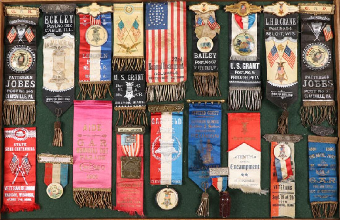 A GROUP OF 18 CIVIL WAR GAR RIBBON BADGES: A GROUP OF 18 CIVIL WAR GAR RIBBON BADGES, CIRCA 1900. Comprising primarily local post badges, including: Claysville, PA, Cable, Ill, Newark, NJ, Boston, Mass, Philadelphia, Beloit, WI, and others. Al