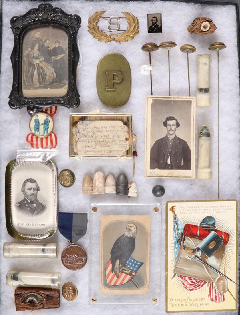 A GROUP OF 30 CIVIL WAR RELATED MATERIAL: A GROUP OF 30 CIVIL WAR RELATED MATERIAL. Including a vast array of items such as buttons, ephemera, projectiles, including a U.S. Grant paperweight, a CDV of a Union soldier, a CDV photogravure of Li