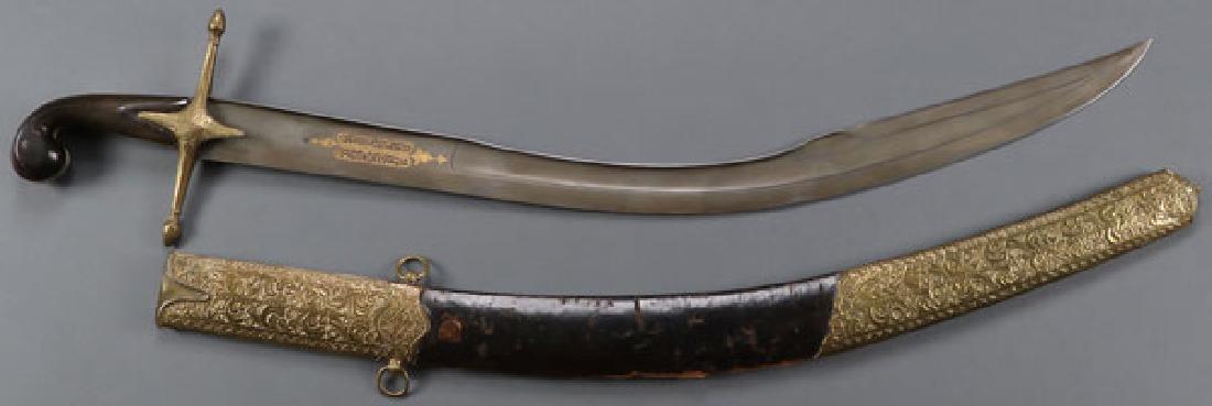 A LARGE OTTOMAN KILIJ SWORD, 19TH CENTURY: A LARGE OTTOMAN KILIJ SWORD, 19TH CENTURY. The wide single edged curved watered steel blade with fuller and reinforced spine, the forte on both sides displaying ornate gilt Arabic inscriptions and one