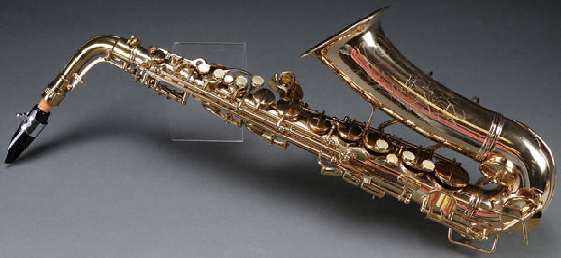 A FINE C. G. CONN “NAKED LADY” ALTO SAXOPHONE: A FINE C. G. CONN “NAKED LADY” ALTO SAXOPHONE, CIRCA 1939. In very fine refinished condition with padded travel case. Serial number 285338. Instrument length 24 inches, overall 26 inches. SHIPPING