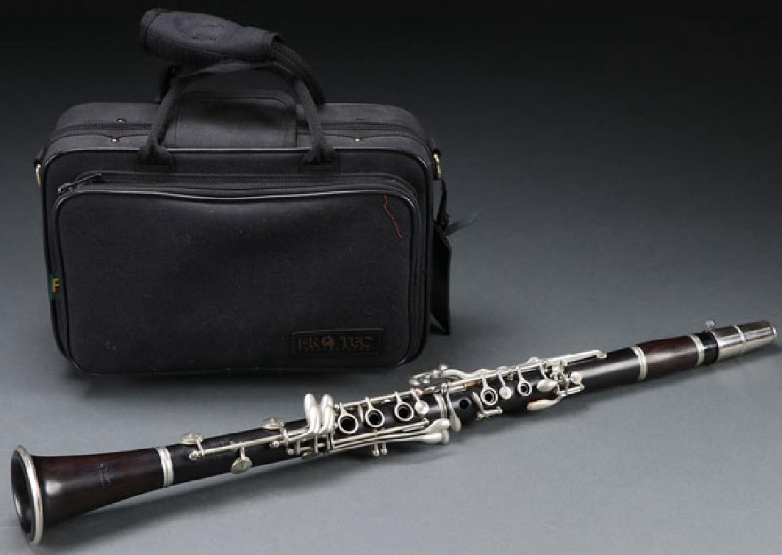 A SELMER CLARINET, MID 20TH CENTURY: A SELMER CLARINET, MID 20TH CENTURY. Rosewood with nickel mounts in fine condition with padded travel case. Serial number 8179. Instrument length 26.75 inches. SHIPPING NOTICE: Jackson’s is your sol