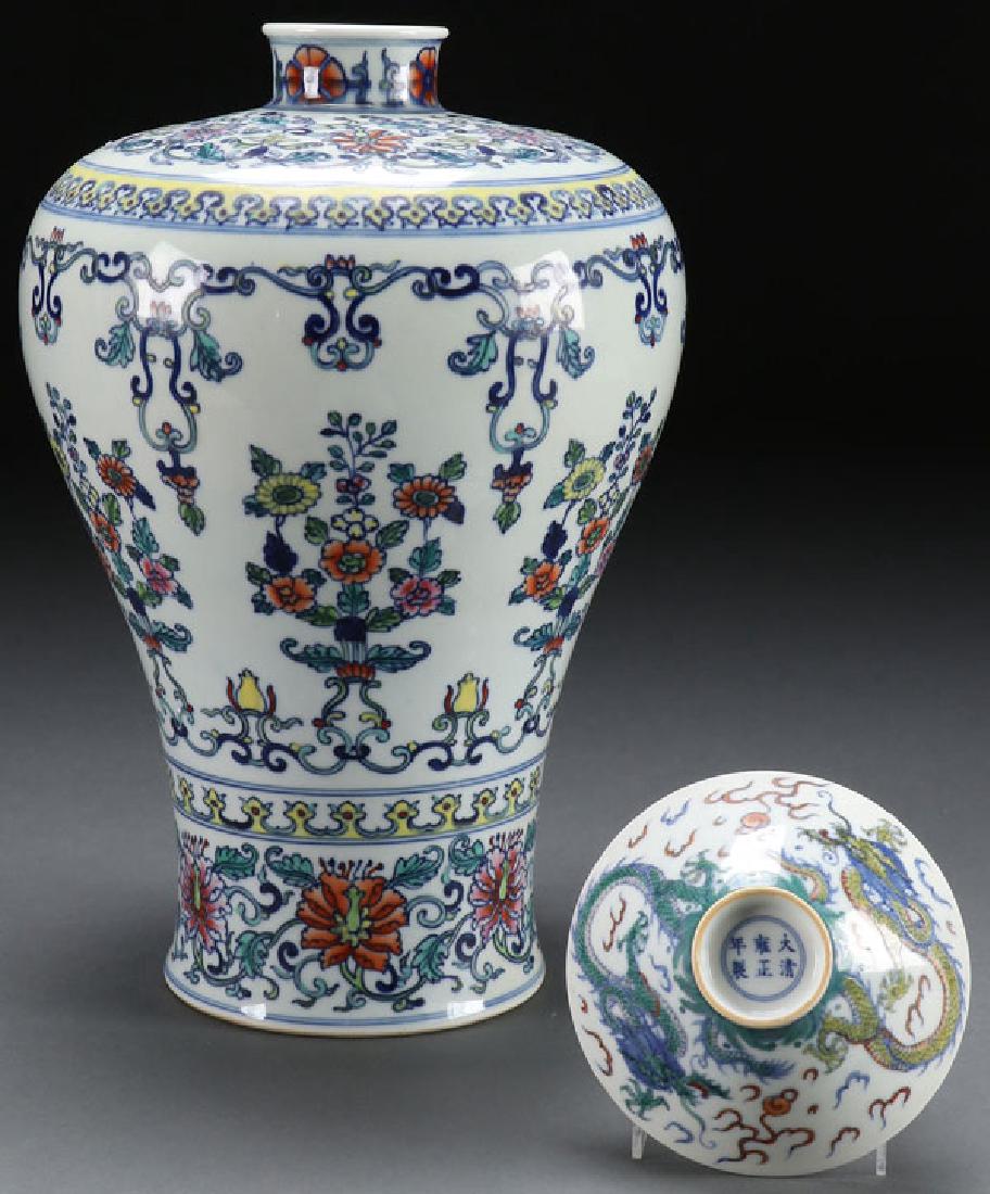 A CHINESE PORCELAIN WUCAI STYLE VASE AND BOWL: A CHINESE PORCELAIN WUCAI STYLE VASE AND BOWL. The vase with scrolled interlocking florals and the bowl with dragons. Each with blue Kangxi style six character marks. Height 13.5 inches (34.3 cm), dia