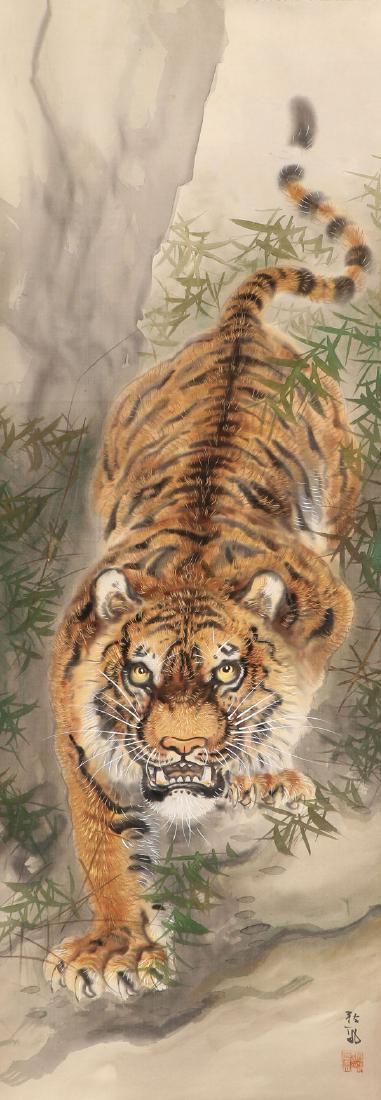 A JAPANESE HAND PAINTED SCROLL: A JAPANESE SCHOOL HAND PAINTED SCROLL. Depicting a crouching tiger. Watercolor on silk. Inscribed lower right with additional red chop mark. Image 44.5 inches x 16 inches (113 x 40.6 cm). SHIPPING NOT