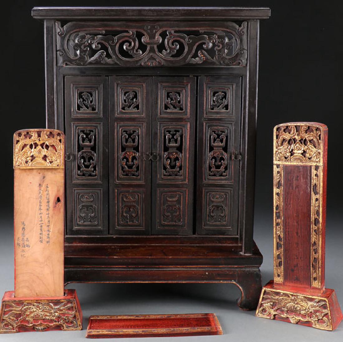 A JAPANESE CARVED WOOD TABLE SHRINE, MEIJI PERIOD: A JAPANESE CARVED WOOD TABLE SHRINE, MEIJI PERIOD. With reticulated bifold doors and overhanging corneous in archaic design opening to reveal two carved and gilt wood wedding tablets with inscriptions