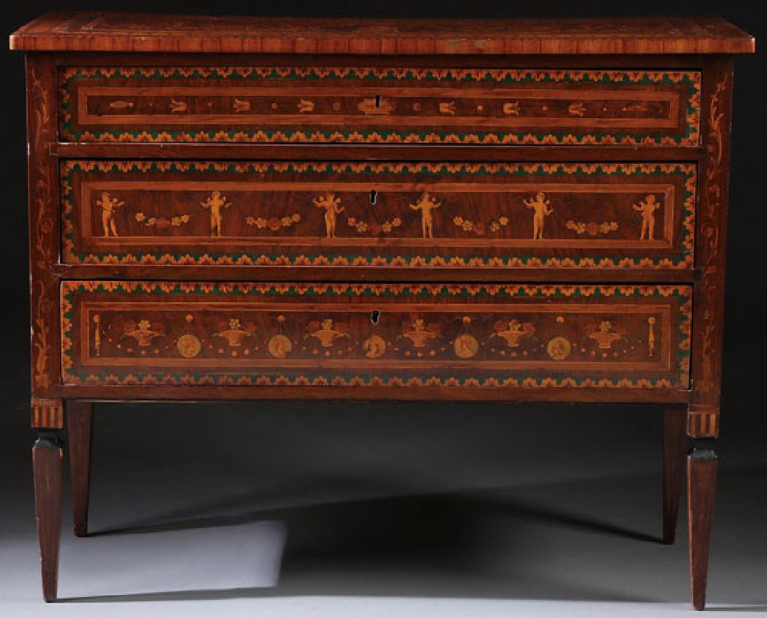 AN 18TH CENTURY ITALIAN MARQUETRY COMMODE: AN 18TH CENTURY ITALIAN MARQUETRY COMMODE. The rectangular mahogany case with three drawers, the front panels with marquetry satin wood green enamel and pen work inlay of bell flowers, floral baskets,