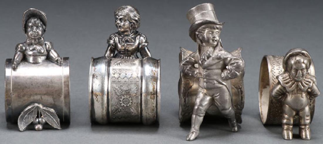4 VICTORIAN SILVERPLATE FIGURAL NAPKIN RINGS (1 of 1)