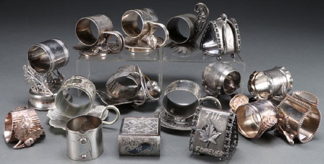 A GROUP OF 16 SILVER PLATE FIGURAL NAPKIN RINGS (1 of 1)
