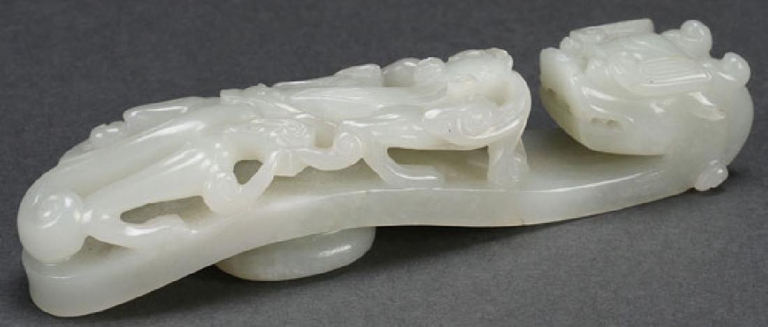 A CHINESE CARVED WHITE JADE BELT HOOK (1 of 7)