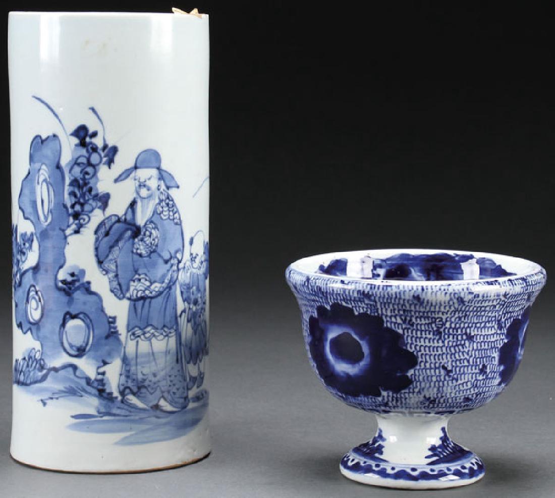 A JAPANESE ARITA BLUE WHITE FOOTED PORCELAIN BOWL: A JAPANESE ARITA BLUE WHITE FOOTED PORCELAIN BOWL, LATE EDO PERIOD. The interior with scenic decoration, the exterior with large floral blossoms.Together with a blue & white prush pot. Height 4.75 inc