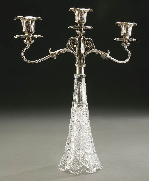 ART NOUVEAU SILVERED MOUNTED CUT GLASS CANDELABRA: ART NOUVEAU SILVERED MOUNTED CUT GLASS CANDELABRA, BRILLIANT, AMERICAN circa 1900; of 2 branch form with floriform candle sockets rising from a cone shaped base cut with starburst and hobnail designs.
