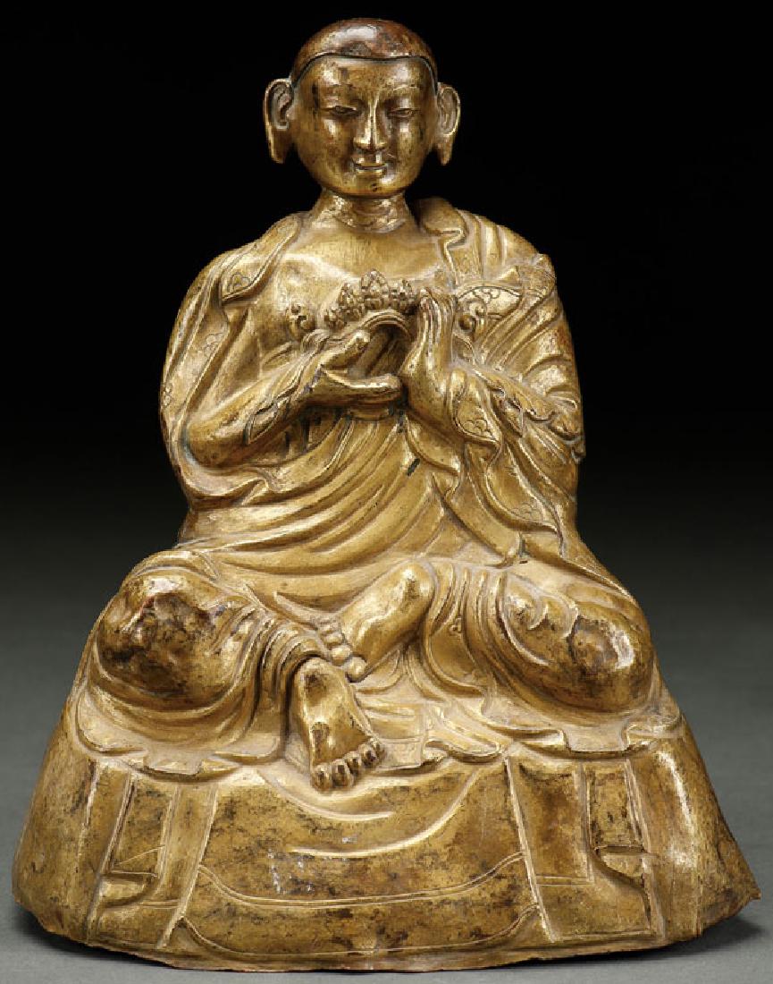 A SINO TIBETAN GILT BRASS FIGURE OF GURU (1 of 7)