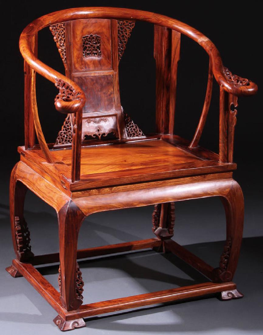 A CHINESE CARVED ELMWOOD "HORSESHOE BACK" ARMCHAIR (1 of 9)