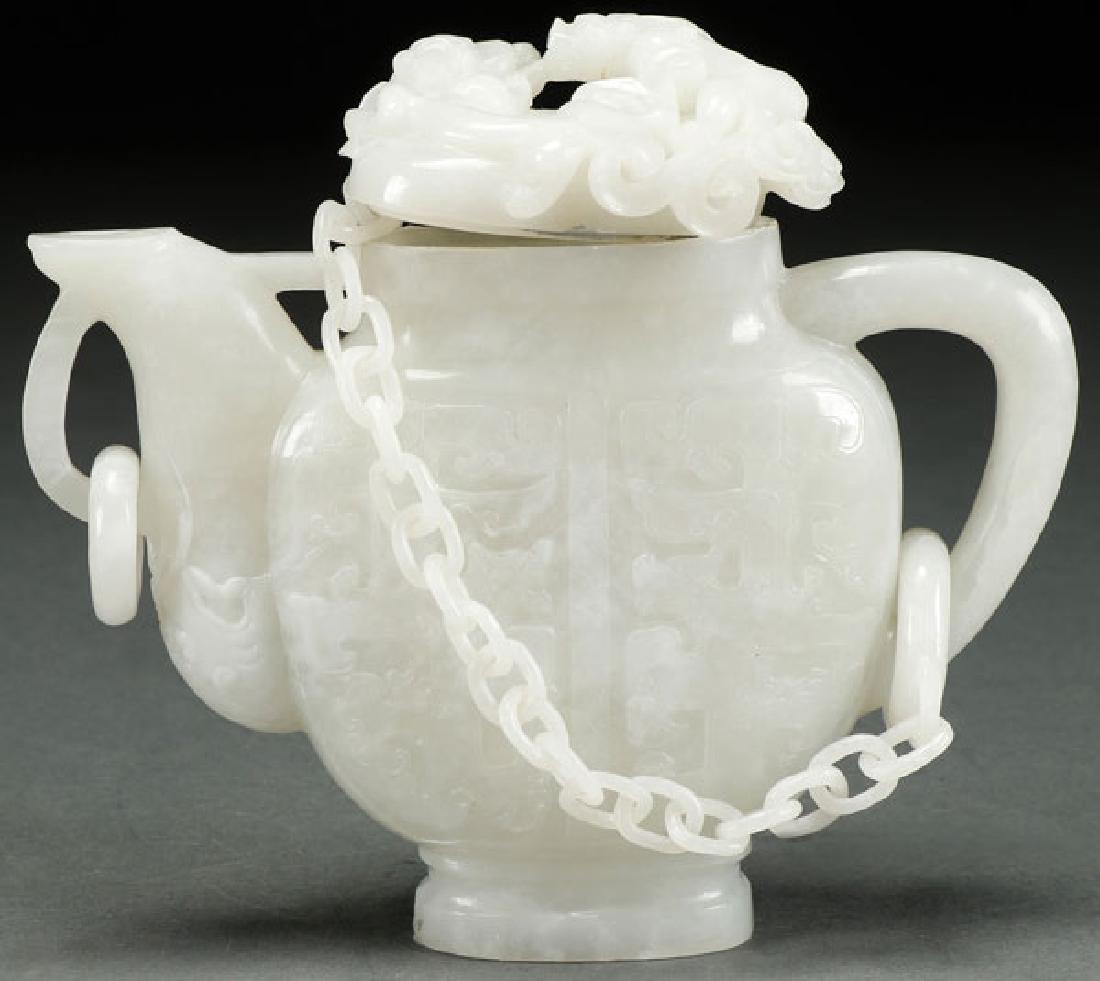 A CHINESE CARVED WHITE JADE ORNAMENTAL TEAPOT (1 of 5)