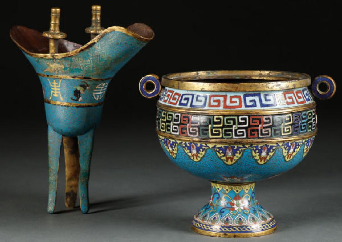 A PAIR OF CHINESE ENAMELED CLOISONNE VESSELS: A PAIR OF CHINESE ENAMELED CLOISONNÉ VESSELS, QING DYNASTY. In the Ming style comprising a handled gilt bronze censer and a three footed gilt bronze ritual wine cup. The largest height 9 inches (23 c