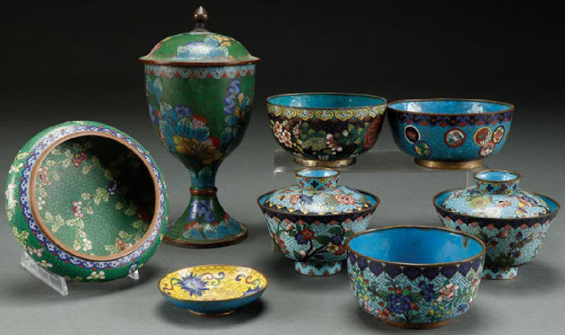 AN EIGHT PIECE CHINESE ENAMELED CLOISONNE GROUP: AN EIGHT PIECE CHINESE ENAMELED CLOISONNÉ GROUP. Comprising a chalice, two covered wine bowls and other items. The largest 7 inches (18 cm). SHIPPING NOTICE: Jackson's is your sole and only s