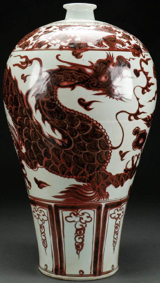 A LARGE AND IMPRESSIVE CHINESE RED OXIDE MEIPING: A LARGE AND IMPRESSIVE CHINESE RED OXIDE MEIPING "œDRAGONS"? VASE. Decorated in the Ming style, unmarked. Tight hairline inside and with early staple repairs. Height 23.5 inches (59.5 cm). SHIPPING N