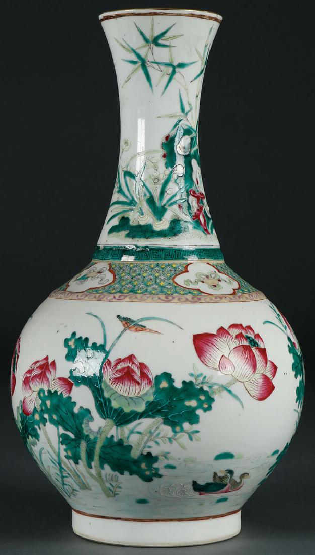 A CHINESE GUANGXU FAMILLE ROSE PORCELAIN VASE: A CHINESE GUANGXU FAMILLE ROSE PORCELAIN VASE. Decorated with lotus birds and Buddhist symbols. The base with six character red oxide mark. Height 15.75 inches (37.5 cm). SHIPPING NOTICE: Ja