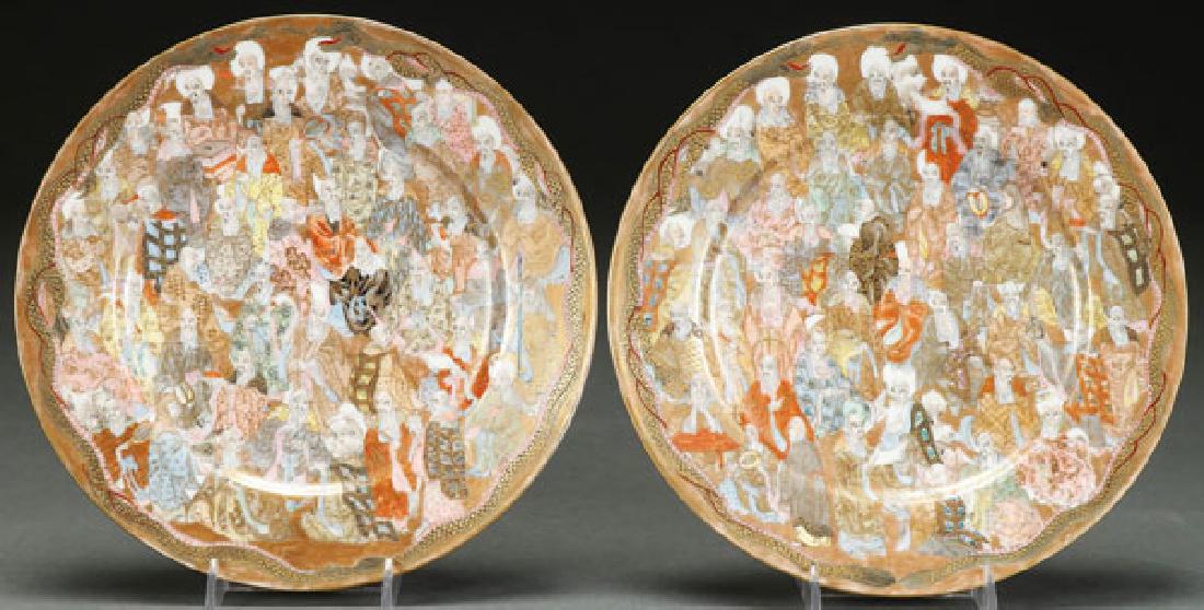A PAIR OF JAPANESE KUTANI "IMMORTALS" PORCELAIN: A PAIR OF JAPANESE KUTANI "œIMMORTALS"? PORCELAIN PLATES. Each decorated with immortals and tooled gilt dragons. Two line four character marks. Diameter 8.5 inches (21.5 cm). SHIPPING NOTICE: