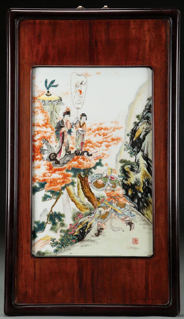 A LARGE CHINESE FAMILLE ROSE PORCELAIN PLAQUE: A LARGE CHINESE FAMILLE ROSE PORCELAIN PLAQUE. Decorated with a mountainous setting with a war lord pleading to Kwan Yin and attendant. Contained in a rosewood and possibly Zitan hardwood frame. 31 in