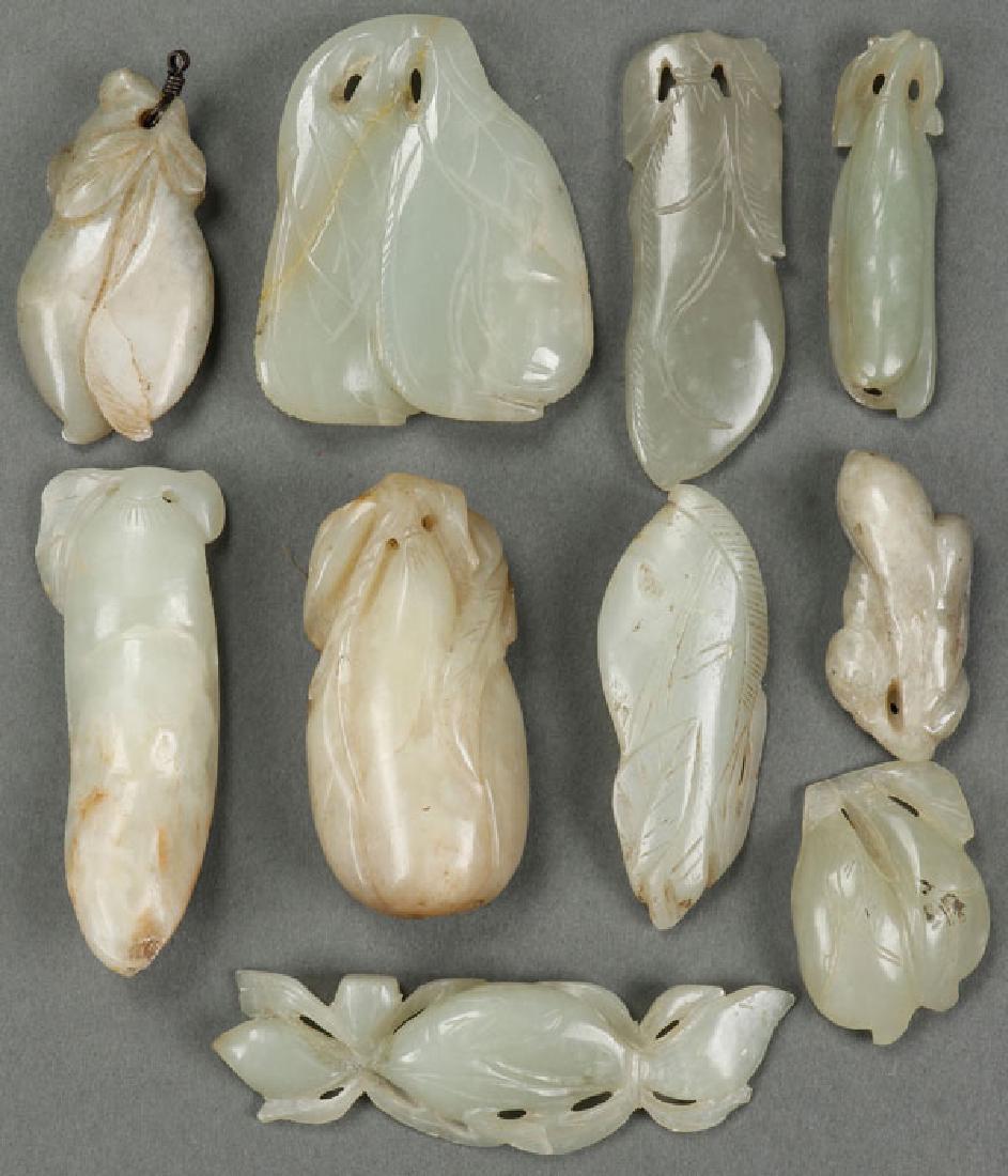 TEN CHINESE CARVED JADE ORNAMENTS: TEN CHINESE CARVED JADE ORNAMENTS. Carved with squash or leaf forms in pale celadon colored white jade. The largest 2.75 inches (7 cm). SHIPPING NOTICE:Jackson's is your sole and only sourc