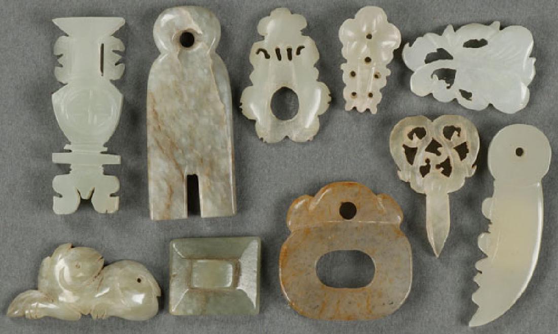 TEN CHINESE CARVED JADE MINIATURE ORNAMENTS: A GROUP OF TEN CHINESE CARVED JADE MINIATURE ORNAMENTS. Including a small chime, knife, scissors, vase forms, button, and foliates. The largest 1.75 inches (4.4 cm). SHIPPING NOTICE: Jackson'