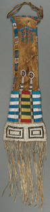 A GOOD PLAINS BEADED HIDE PIPE-BAG 19TH CENTURY: AN EARLY PLAINS BEADED HIDE PIPE-BAG, PROBABLY CHEYENNE, 19TH CENTURY. The majority of the multicolored sinew sewn beads of small (seed) size on the upper section, rendered in geometric patterns and